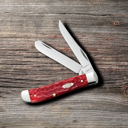Razor Sharp AZ Case Mini Trapper knife with dark red bone peach seed jig handle and two polished carbon steel blades.