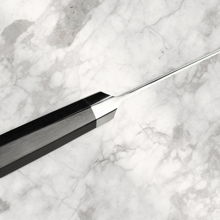 Razor Sharp AZ Shun Dual Core 7-inch Santoku knife showing the ebony PakkaWood octagonal handle and steel bolster