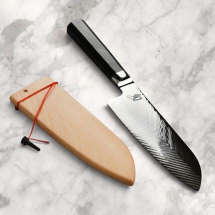 Razor Sharp AZ Shun Dual Core 7-inch Santoku knife with herringbone steel blade and black PakkaWood handle with sheath