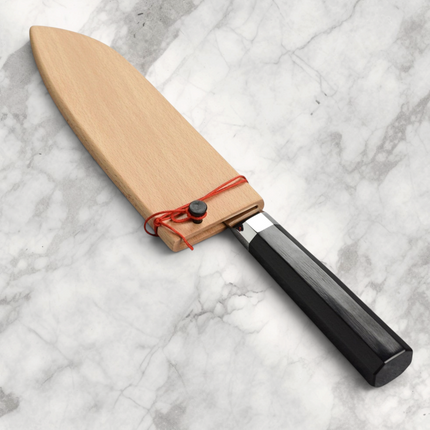 Razor Sharp AZ Shun Dual Core 7-inch Santoku knife with ebony PakkaWood handle and wooden saya sheath on marble