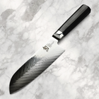 Razor Sharp AZ Shun Dual Core 7-inch Santoku knife with a herringbone blade and black octagonal PakkaWood handle.