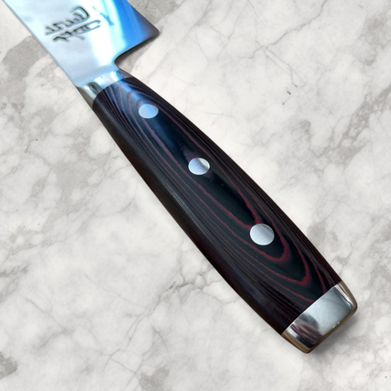 Razor Sharp AZ Dragon Fire 180mm Nakiri knife featuring a black Micarta handle with three silver rivets.