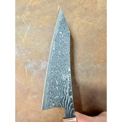 Honesuki 5.5-inch boning knife with Damascus-pattern blade, carbon-infused resin handle, and brass bolster.