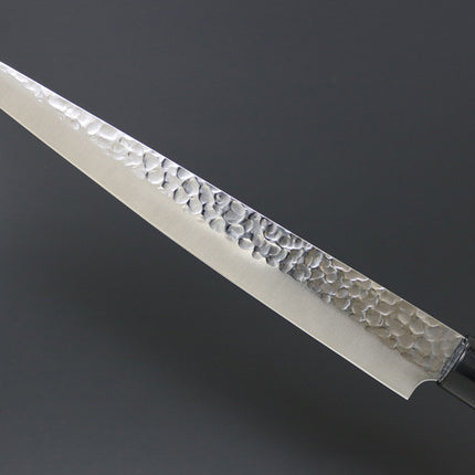 KC-959 Sujihiki Carbon 240mm knife by Kanetsune with hammered blade and wooden handle.