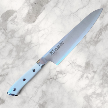 Razor Sharp AZ Perfect Edge Shiro Hane 8.5-inch Gyuto knife with a white Corian handle and nitrogen-infused steel blade.