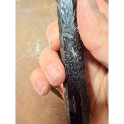 Honesuki 5.5-inch boning knife with Damascus-pattern blade, carbon-infused resin handle and brass bolster.