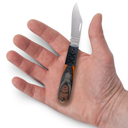 Razor Sharp AZ Case XX Crossroads XR Barlow folding knife with Ember Glow wood handle held in a palm