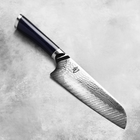Razor Sharp AZ Shun Shiranami 7-inch Santoku knife with a wave-pattern Damascus steel blade and dark micarta handle.