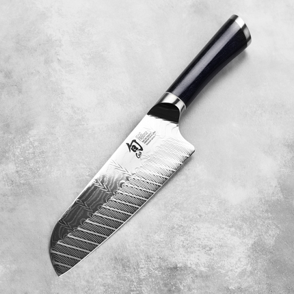 Razor Sharp AZ Shun Shiranami 7-inch Santoku knife with a wave-pattern Damascus blade and dark micarta handle.