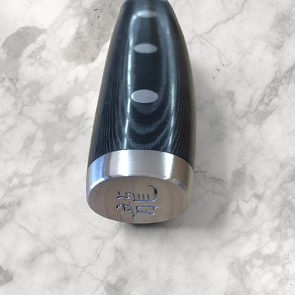 Razor Sharp AZ Dragon by Apogee chef knife handle with black micarta and stainless steel pommel featuring engraving
