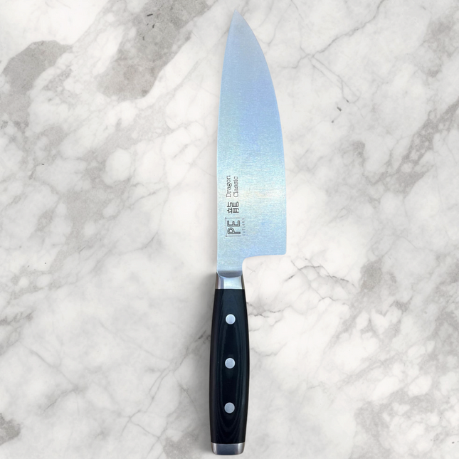 Razor Sharp AZ Perfect Edge Cutlery Dragon Classic 8-inch chef's knife with black Micarta handle on a wooden board
