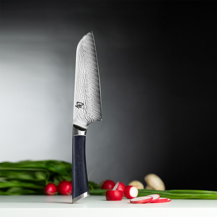Razor Sharp AZ Shun Shiranami 7-inch Santoku knife with wave-pattern Damascus steel blade and dark micarta handle.