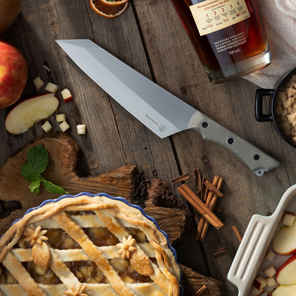 Razor Sharp AZ Messermeister Overland 8-inch chef camp knife with canvas Micarta handle on a rustic wooden table.
