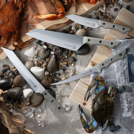 Razor Sharp AZ collection of Messermeister Overland camp knives with canvas Micarta handles on a sandy beach setting.
