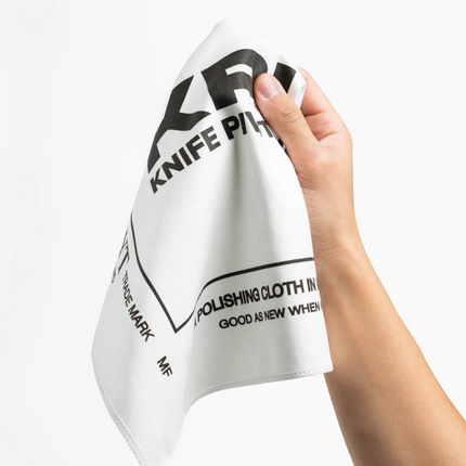 Razor Sharp AZ KPL Selvyt MF white microfiber polishing cloth held in hand for cleaning knives and precision tools