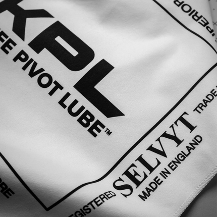 Razor Sharp AZ KPL Selvyt MF microfiber polishing cloth with black branding text on a white fabric surface