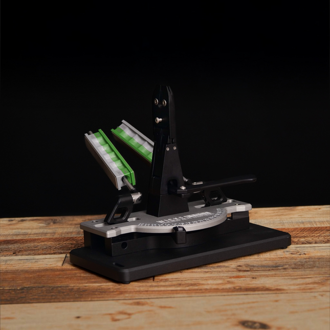 Razor Sharp AZ low angle and small knife adapter attached to a Wicked Edge sharpening system on a wooden surface