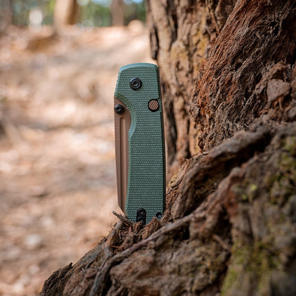 Raccoon 2.0 Top Liner Lock knife with 3.25-inch 14C28N copper-dune drop-point blade and green Micarta handle.