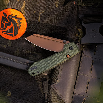 Raccoon 2.0 A2907 liner-lock folding knife with 3.25-inch 14C28N drop-point copper-dune blade and green Micarta handle.