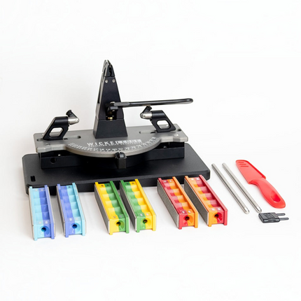 Razor Sharp AZ Generation 4 Pro knife sharpener kit with anodized aluminum base, vise, and various diamond stone sets.
