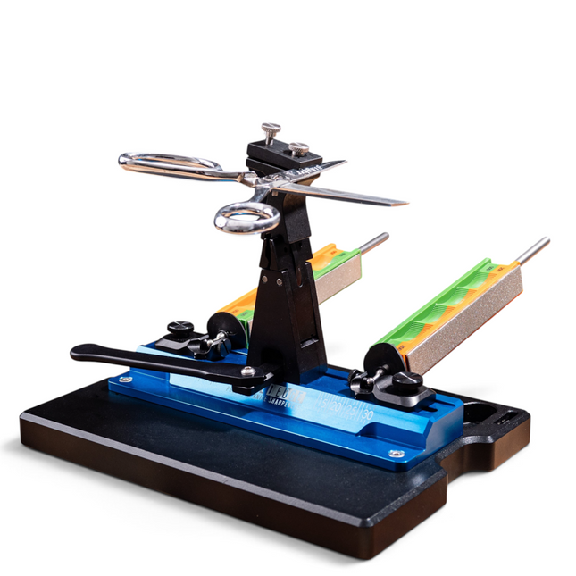 Razor Sharp AZ scissor attachment mounted on a Wicked Edge sharpener with metal scissors clamped for sharpening
