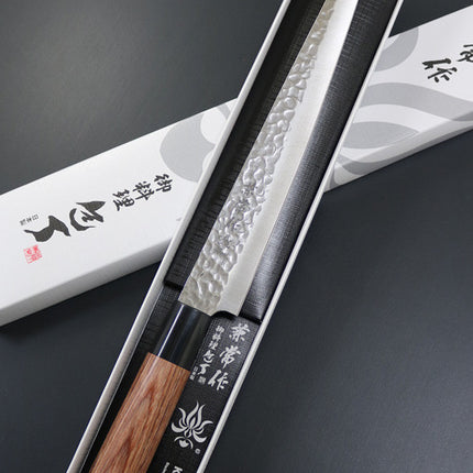 KC-959 Sujihiki Carbon 240mm Kanetsune knife with hammered blade and wooden handle in box.