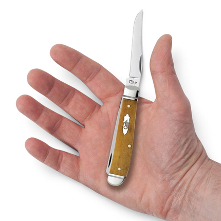 Razor Sharp AZ Case Smooth Antique Bone Mini Trapper knife with dual stainless steel blades held in a hand
