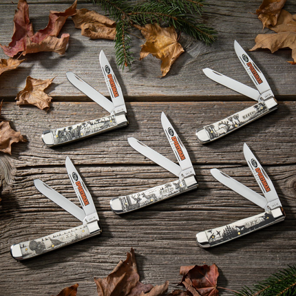 Razor Sharp AZ Case Sportsman Series Bear Trapper knives with smooth natural bone handles and etched wildlife scenes.