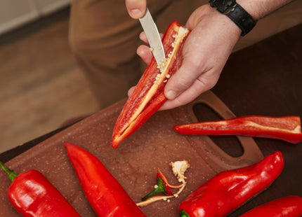 Razor Sharp AZ blade sharpening service: person slicing a red pepper with a knife.