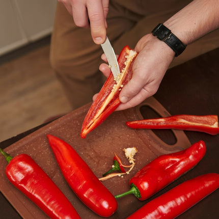 Razor Sharp AZ blade sharpening service: person slicing a red pepper with a knife.