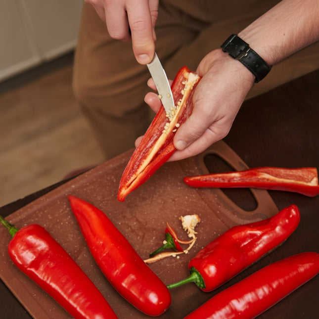 Razor Sharp AZ blade sharpening service: person slicing a red pepper with a knife.
