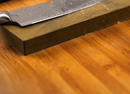 Razor Sharp AZ blade sharpening service uses a whetstone to restore dull kitchen knives to a precise, sharp edge.
