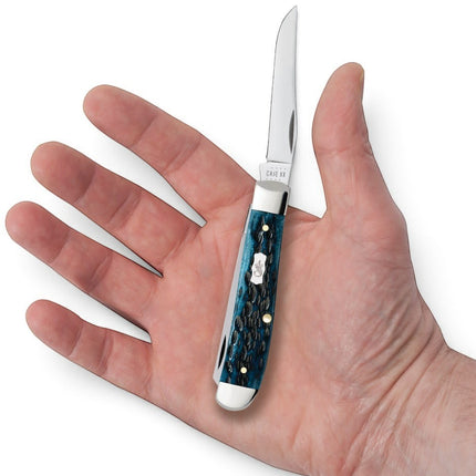 Razor Sharp AZ Case Mini Trapper knife with Mediterranean blue peach seed jigged bone handle held in a palm