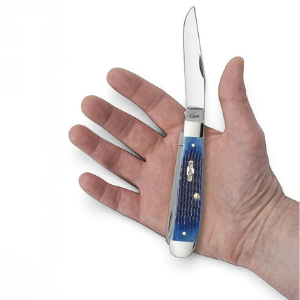 Razor Sharp AZ Case Rogers corn cob jigged blue bone trapper knife held in a hand with a mirror-polished steel blade
