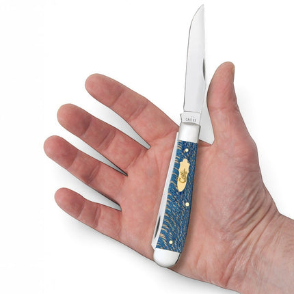 Razor Sharp AZ Case Trapper knife with a smooth blue sycamore wood handle and polished steel blades held in a hand.