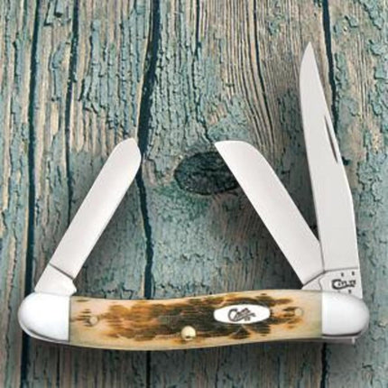 Razor Sharp AZ Case Medium Stockman knife with peach seed jig amber bone handle and three stainless steel blades