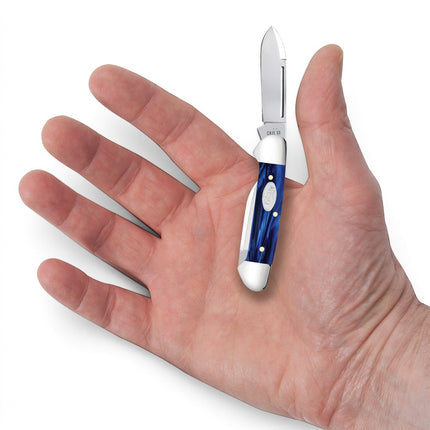 Razor Sharp AZ Case Baby Butterbean knife with blue pearl Kirinite handle and stainless steel blades held in a hand