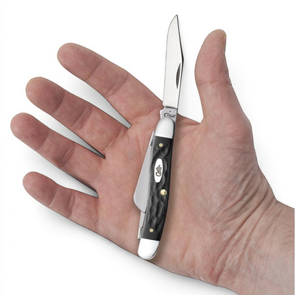 Razor Sharp AZ Case Rough Black synthetic medium Stockman pocket knife with three stainless steel blades in a hand.