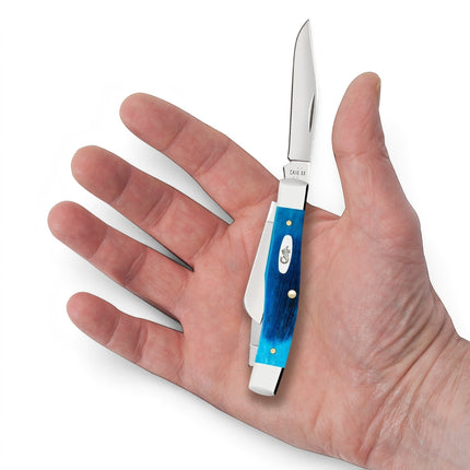 Razor Sharp AZ Case Medium Stockman pocket knife with Caribbean blue sawcut jigged bone handle held in a palm