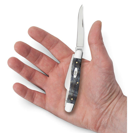Razor Sharp AZ Case Medium Stockman knife with a blue curly oak handle and polished stainless steel blades in a hand