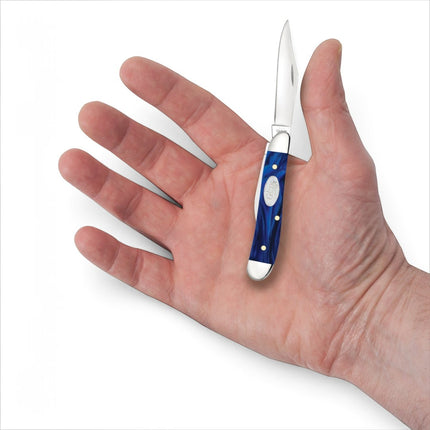 Razor Sharp AZ Case Peanut pocket knife with a smooth blue pearl Kirinite handle held in an open palm