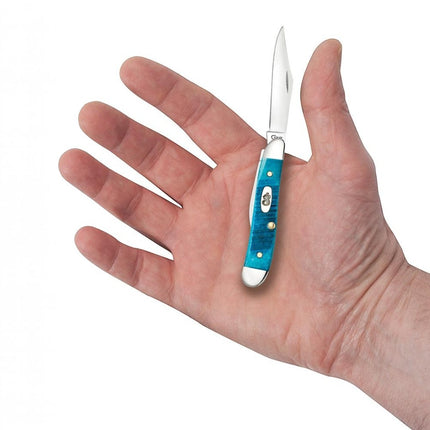 Razor Sharp AZ Case Caribbean Blue bone handle Peanut pocket knife held in a palm showing its compact size