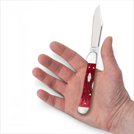 Razor Sharp AZ Case CopperLock knife with dark red bone peach seed jig handle and polished carbon steel clip blade.