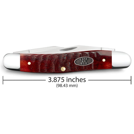 Razor Sharp AZ Case Gator Jigged Old Red Bone Muskrat pocket knife with a textured handle and polished steel bolsters