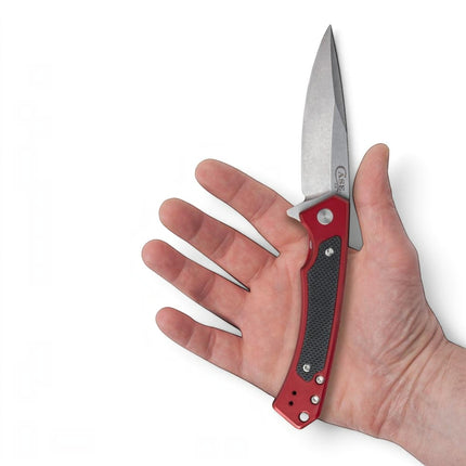 Razor Sharp AZ Case Marilla folding knife with red anodized aluminum handle and black G-10 inlay held in a hand