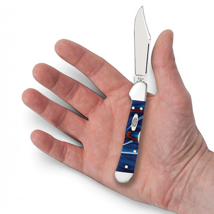 Razor Sharp AZ Case Mini CopperLock pocket knife with patriotic red, white, and blue Kirinite handle held in a hand.