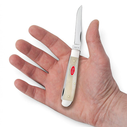 Razor Sharp AZ Case Mini Trapper pocket knife with smooth natural bone handle and red oval shield held in a hand