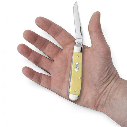 Razor Sharp AZ Case Yellow Synthetic Mini Trapper pocket knife with two stainless steel blades held in a hand