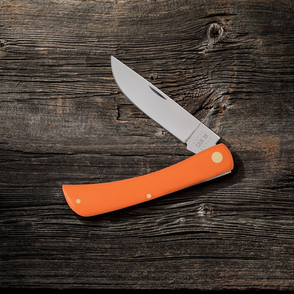 Razor Sharp AZ Case Orange Synthetic Sod Buster folding knife with a mirror-polished stainless steel blade