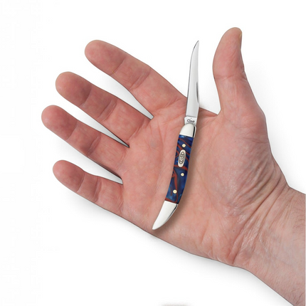 Razor Sharp AZ Case Small Texas Toothpick knife with a red, white, and blue Patriotic Kirinite handle in a hand.